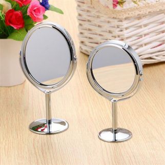 A small metal mirror, a desktop mirror, a double-sided makeup mirror.